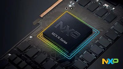 A close-up view of an NXP MCX N Series microchip mounted on a dark circuit board. The chip is highlighted with a glowing, multi-colored outline, emphasizing its central position among other electronic components. The NXP logo is clearly visible in the bottom right corner, and the text 'MCX N Series' is printed on the chip surface.