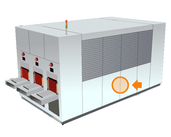 Una grande macchina industriale con più compartimenti dotati di indicatori rossi visibili e vassoi scorrevoli.