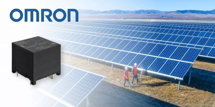 A black Omron relay is prominently displayed alongside a vast solar panel field. T