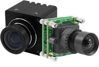 A compact dual-lens camera module featuring visible circuit boards and precision lenses