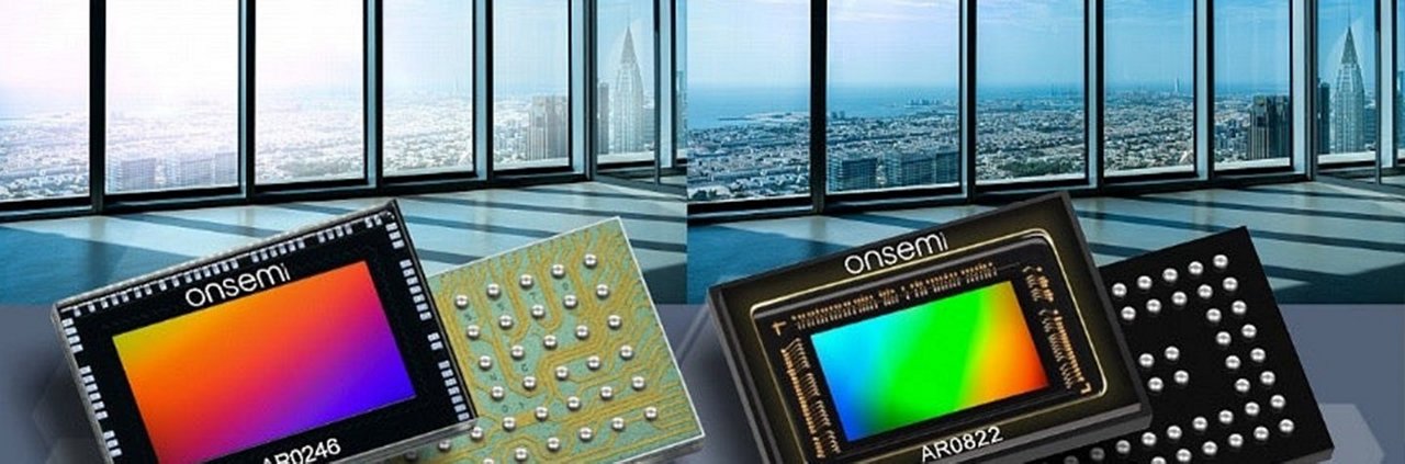 Two Onsemi image sensors, models AR0240 and AR0822, are displayed against a backdrop of a modern cityscape seen through large glass windows.