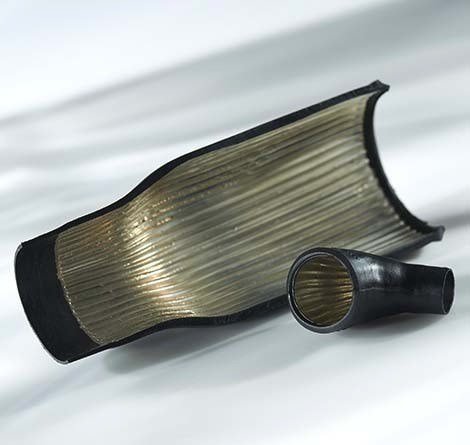 A close-up of flexible ribbed tubing with a cutaway section revealing its internal structure