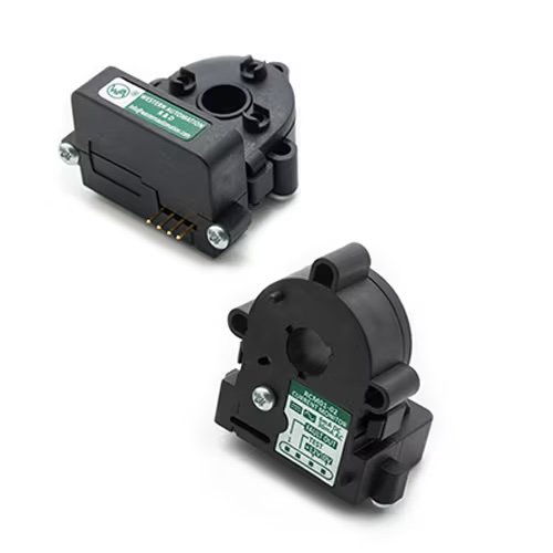 Two black rotary position sensors are shown, each featuring a green and white label with visible text and numeric values. The sensors have a circular central opening and multiple mounting points, with gold connector pins visible on one unit.