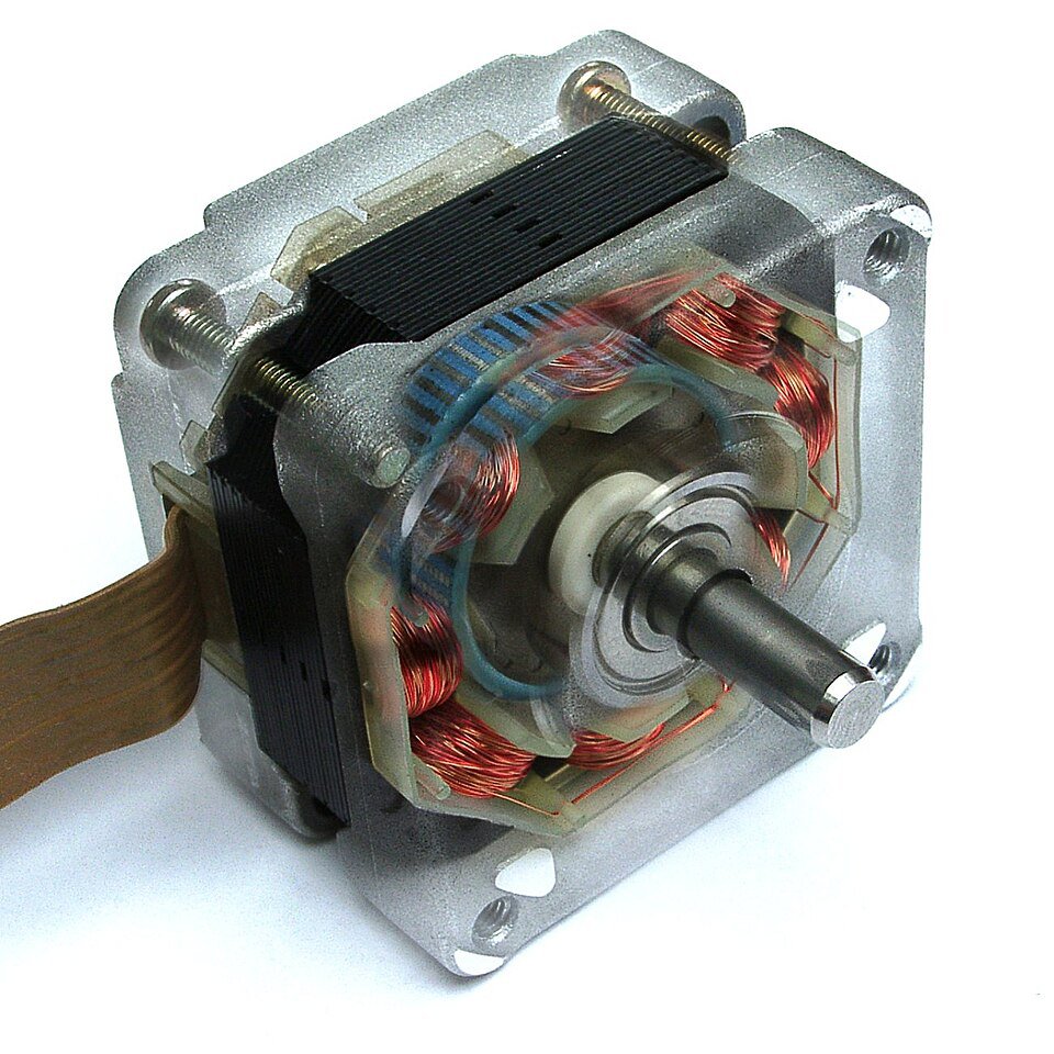 A detailed view of an electric motor showcasing its internal components, including copper coils and a central shaft. 