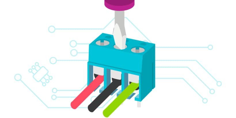 A colorful electrical connector with three wires in black, red, and green, attached to a blue terminal block