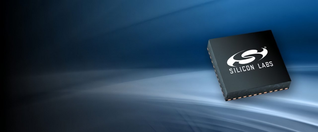 A Silicon Labs microchip is prominently displayed against a sleek blue gradient background.