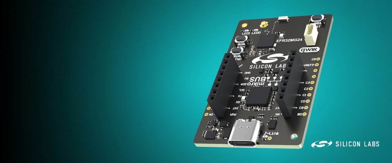 A modern drone hovers above a large field of solar panels during daylight.