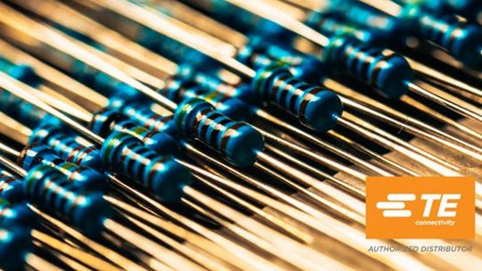 Close-up of electronic resistors and TE logo
