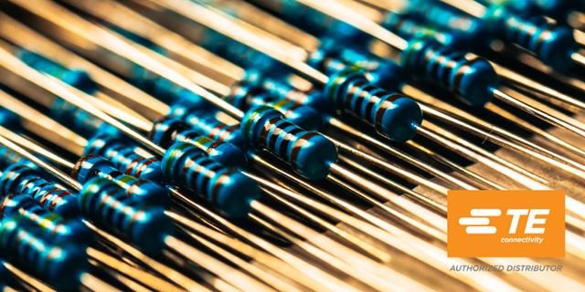 Close-up of electronic resistors and TE logo