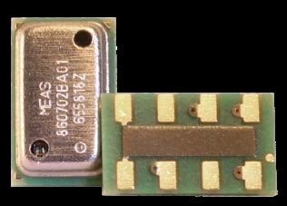 Close-up of a compact electronic sensor module featuring metallic and green components. Visible text includes 'MEAS' and numeric codes '850702EA01' and '675816Z'. The module showcases intricate design with solder points and connectors, suitable for precision applications.