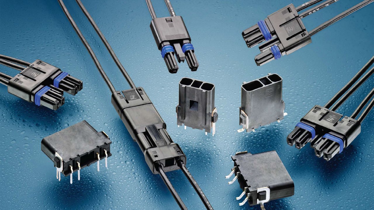 A variety of electrical connectors are displayed on a textured blue surface with water droplets. 