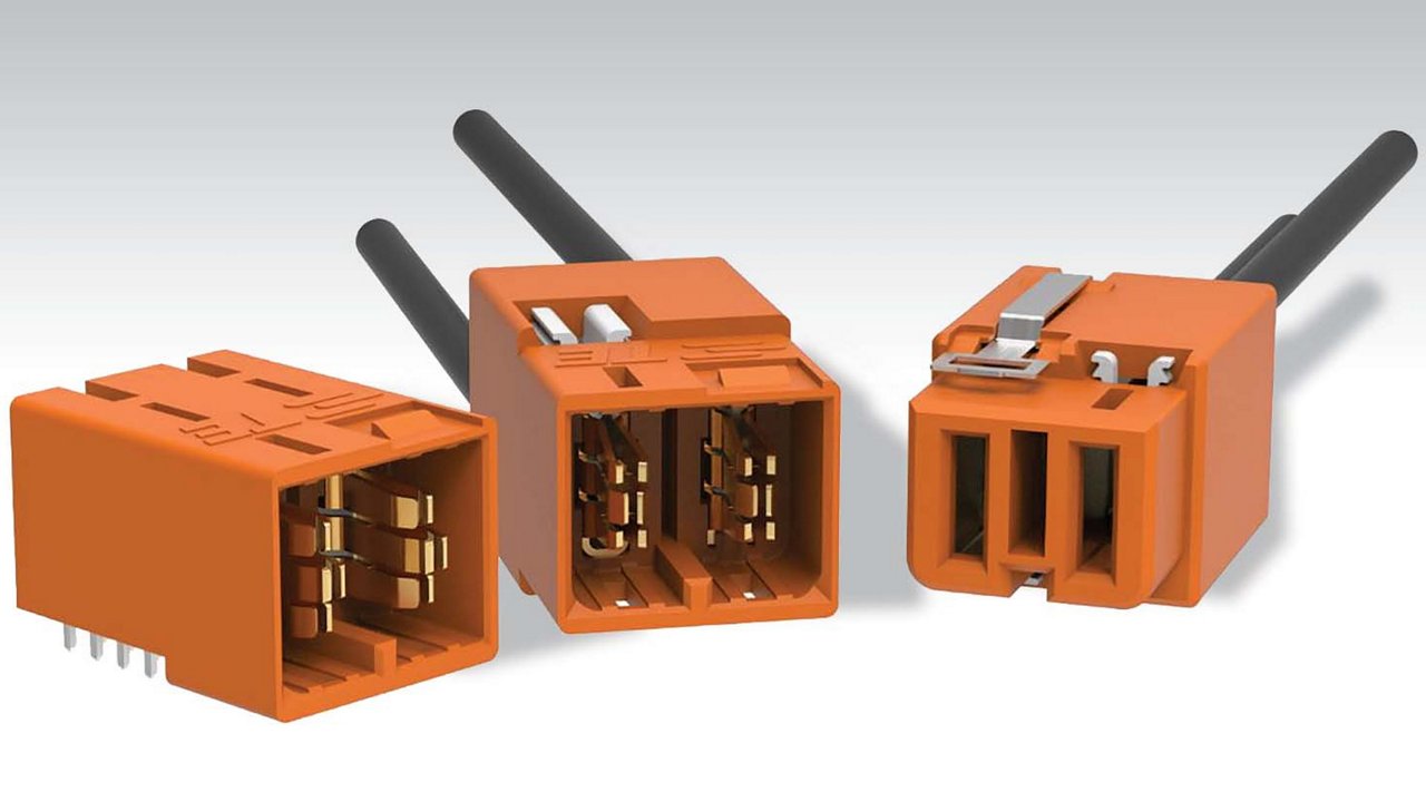 Three orange electrical connectors are displayed, each featuring distinct designs and metallic components