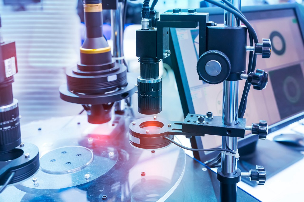 Close-up view of an automated optical inspection setup in an industrial environment