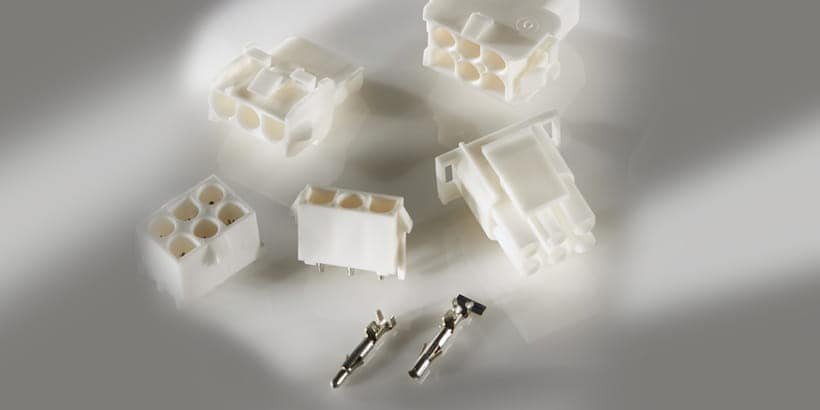 A collection of white plastic electrical connectors displayed on a neutral background