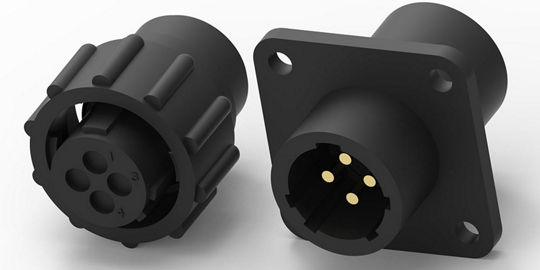 Two black circular electrical connectors are displayed, featuring a 4-pin configuration. 