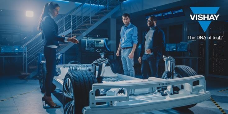 A group of engineers examines a futuristic automotive prototype in a high-tech laboratory. The setting features advanced computer screens and industrial lighting, emphasizing innovation and technology
