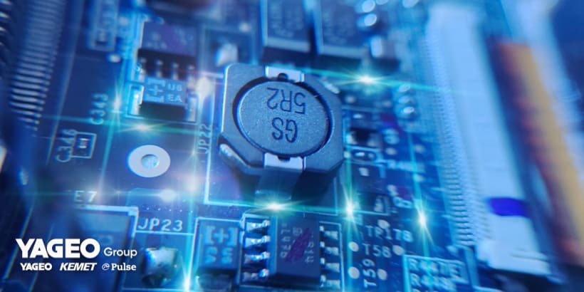 A detailed view of electronic components on a circuit board, featuring a visible capacitor