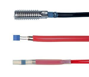 Close-up of three industrial heating elements featuring distinct designs and wiring