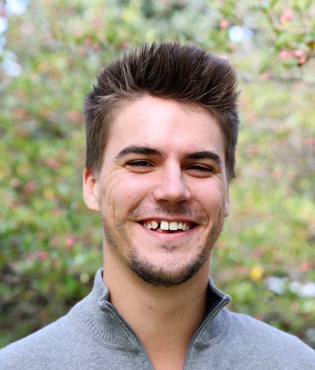 Portrait headshot of author Zach DeMeyer