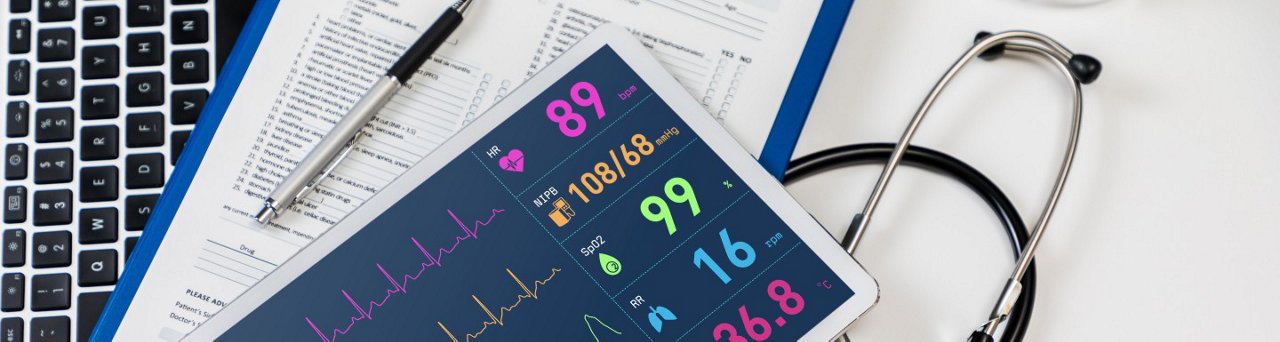 Image of remote therapeutic monitoring - tablet, patient chart, and stethoscope