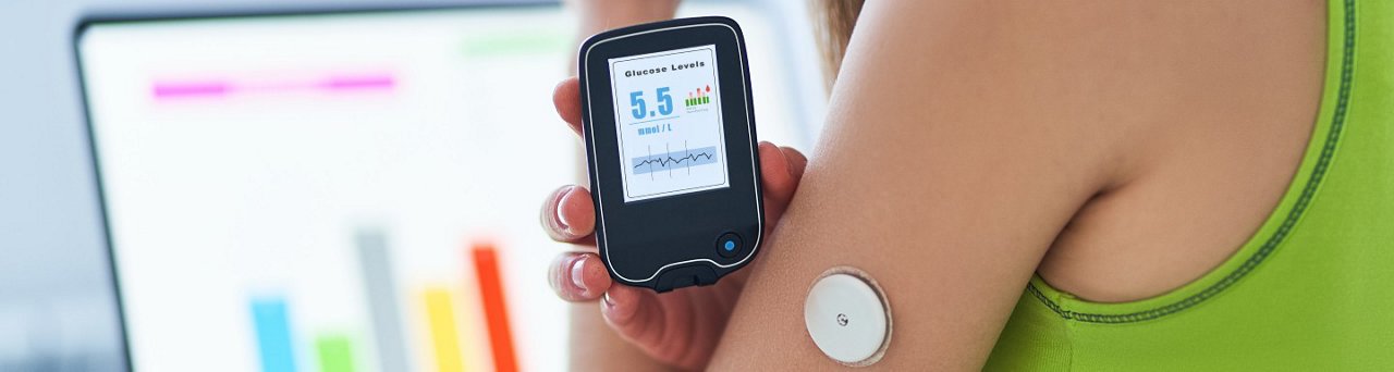 Diabetic patient using remote sensor and laptop