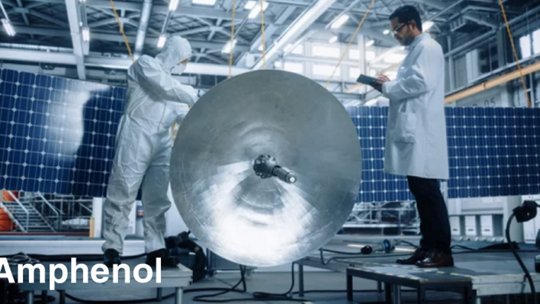 Workers inspecting aerospace machinery