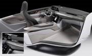 A futuristic car interior featuring a minimalist dashboard and ergonomic seating. 