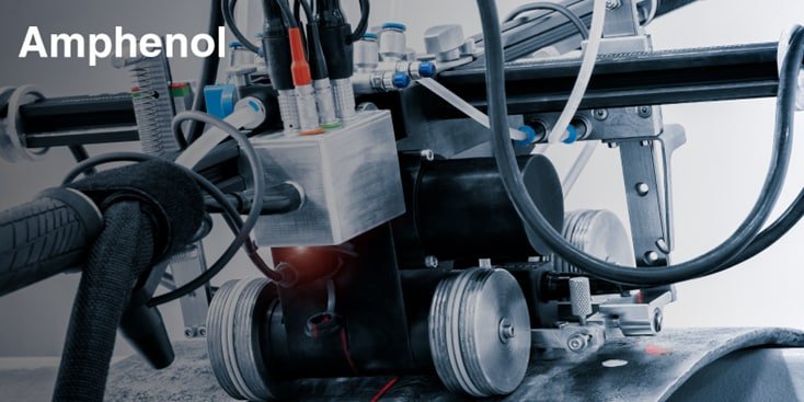 Close-up of Amphenol industrial machinery, featuring complex components, wiring, and metal parts.