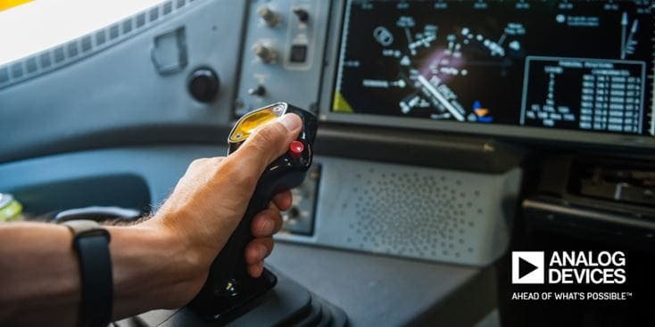 Hand operating joystick in cockpit setting