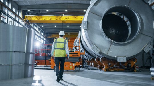 Man walking in rocket manufacturing plant