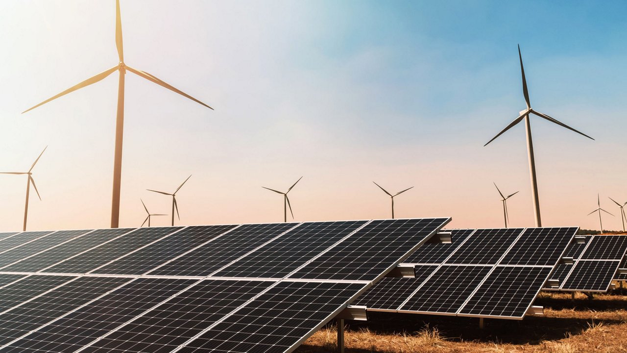 Clean energy concept. solar panel with wind turbine and blue sky