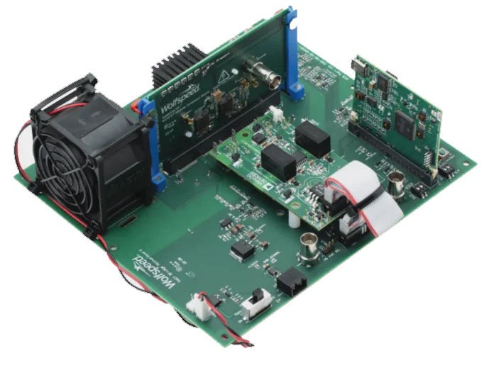 A detailed view of an electronic circuit board featuring multiple components, including a cooling fan and various connectors.