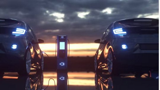 Electric cars charging at a charging station