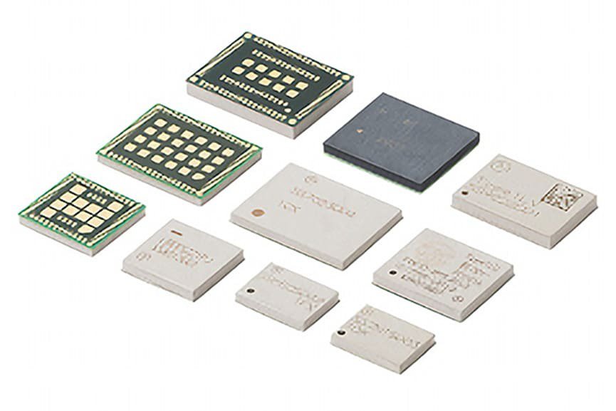 A collection of electronic microchips and modules displayed on a white background.