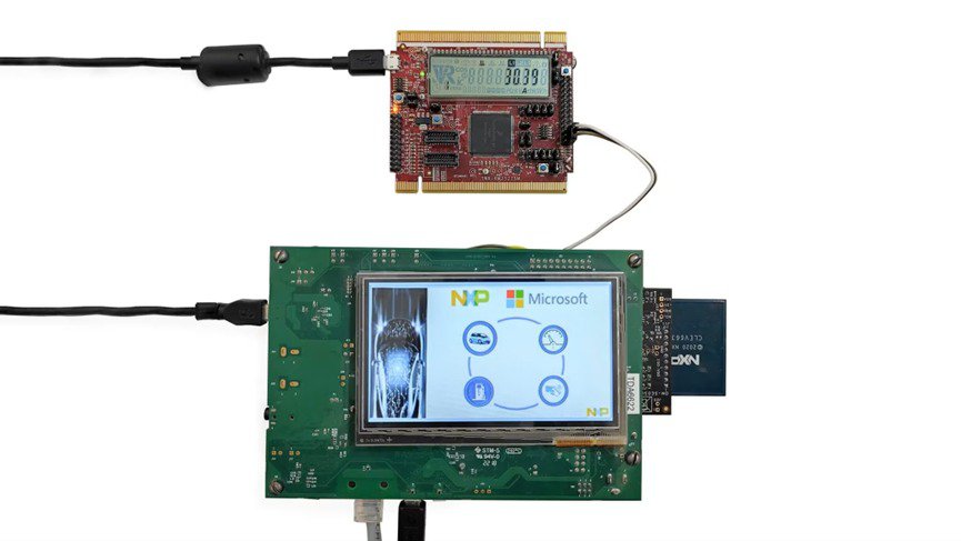 Two electronic circuit boards are connected via cables, showcasing advanced technology. 