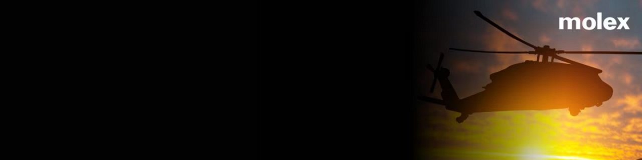 A helicopter is seen in silhouette against a vibrant sunset sky, with the word 'molex' clearly visible in the upper right corner. 