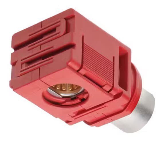 A close-up view of a red electrical connector featuring a metallic base and intricate grooves. 