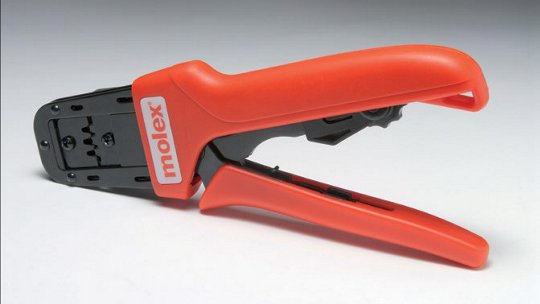 A Molex crimping tool with bright red handles designed for precision wire crimping