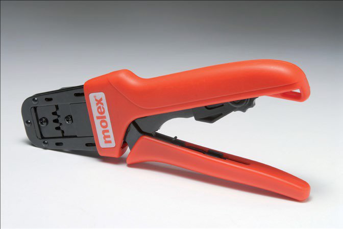 A Molex crimping tool with bright red handles designed for precision wire crimping