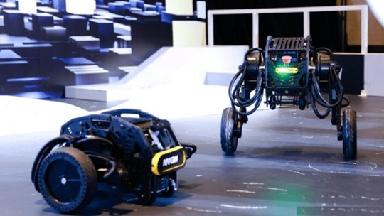 Two advanced robotic devices are displayed in a futuristic setting, featuring sleek designs and dynamic mobility