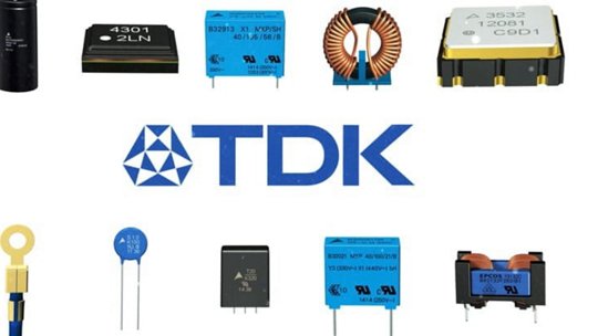 A collection of various TDK electronic components arranged on a white background