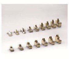 A collection of small metal connectors arranged in neat rows on a plain white background