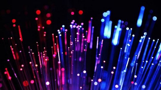 A vibrant display of fiber optic lights in a dark setting
