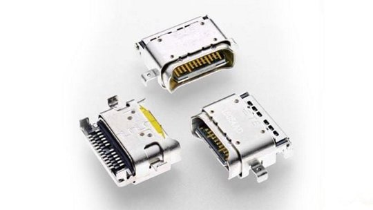 A detailed view of three metallic electronic connectors, showcasing their intricate pin configurations