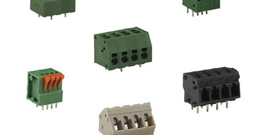 A collection of six electrical terminal block connectors in various colors and designs. 