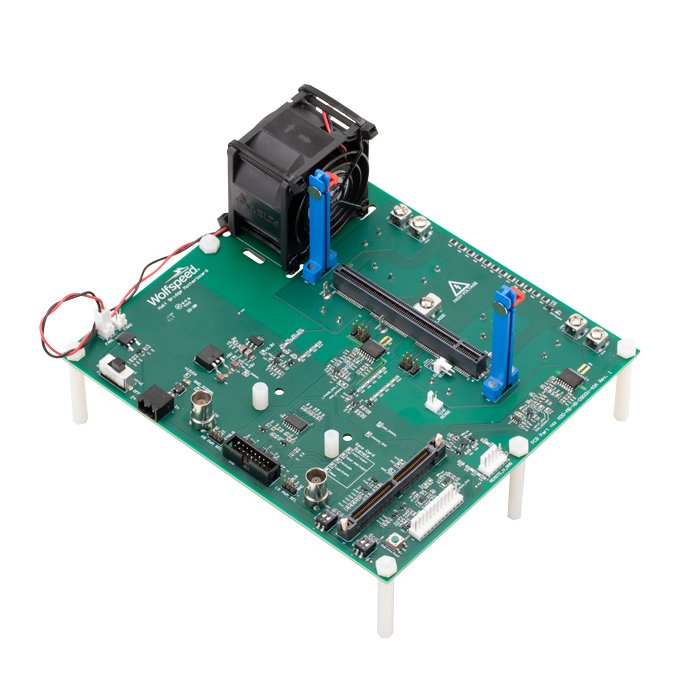 A green circuit board featuring various electronic components, including connectors, resistors, and a cooling fan