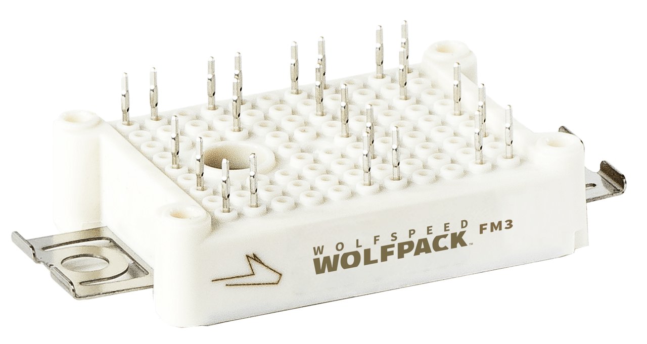 Close-up of a Wolfspeed Wolfpack FM3 power module featuring multiple pins and a white casing. 