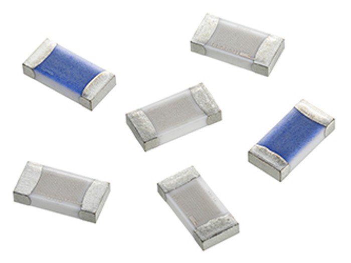 A detailed view of six small electronic resistors arranged on a white background